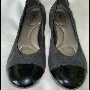 Black flats with shiny toe and heels. Size 10.